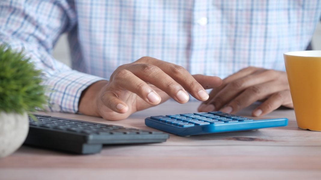 Accountant using a calculator