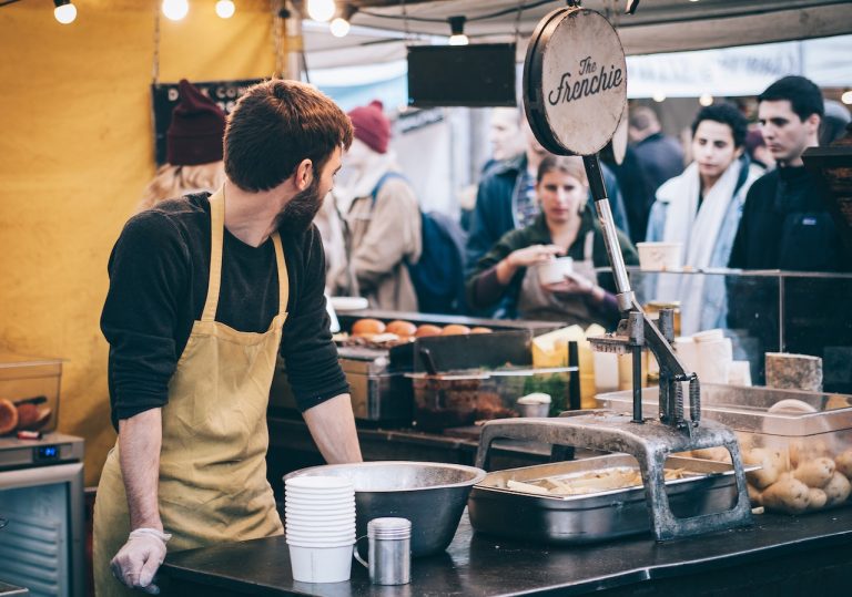 A man starting a food business that is running successfully.